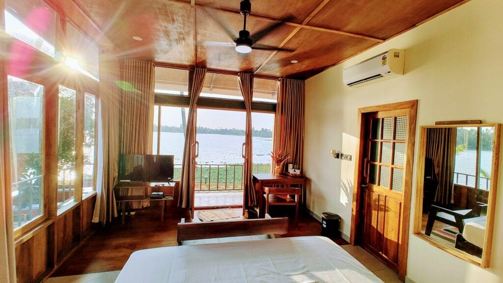 Villa interior opening onto the backwaters at Kyna Backwaters, Kainakary