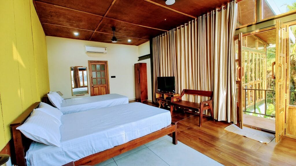 Garden View Cottage bedroom at Kyna Backwaters, Alleppey