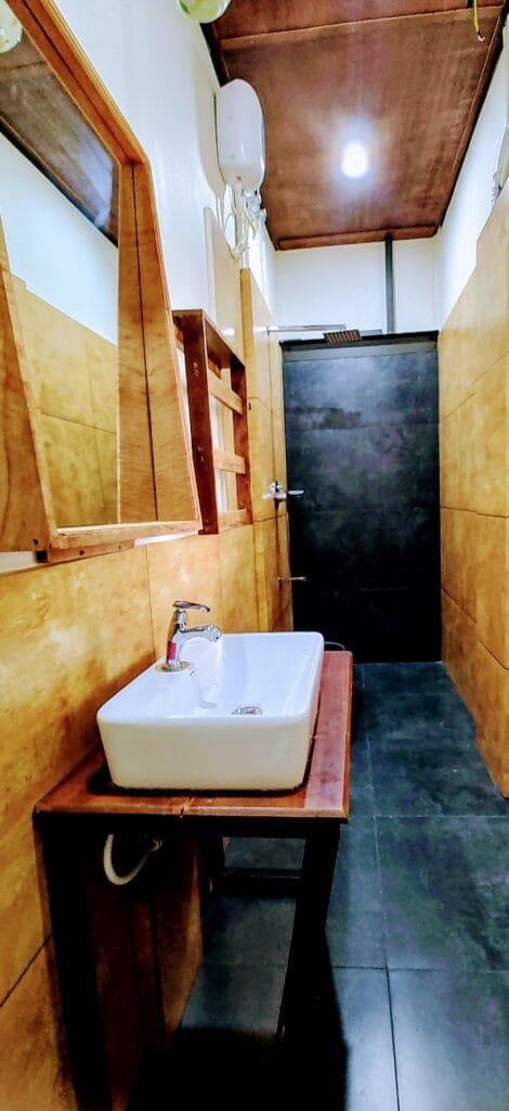 Modern villa bathroom with vessel sink at Kyna Backwaters, Alleppey
